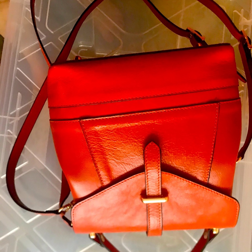 Beautiful orange colour. Italian leather bag Can be bag, cross body and backpack